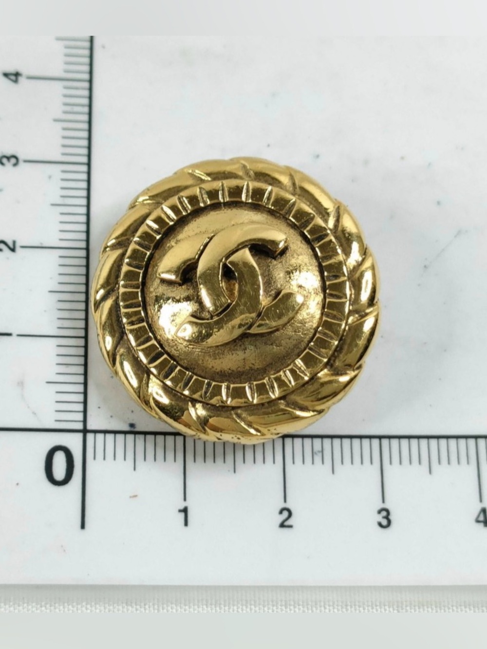 A Pair of Vintage Chanel Gold-Tone CC Medallion Button Clip-On Earrings - Picture 2 of 10